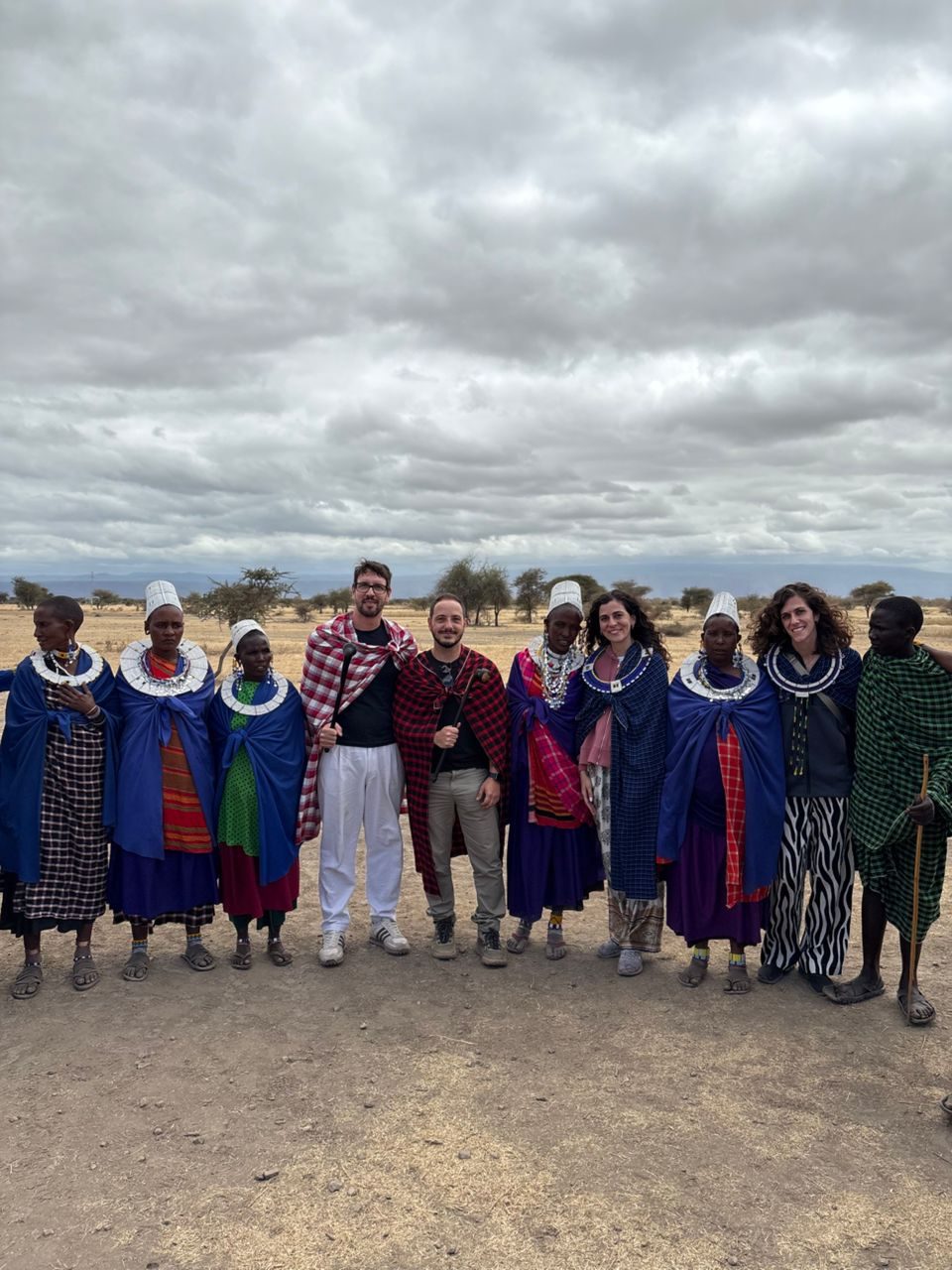 Guests visiting a Maasai village on a Tanzania safari and culture tour