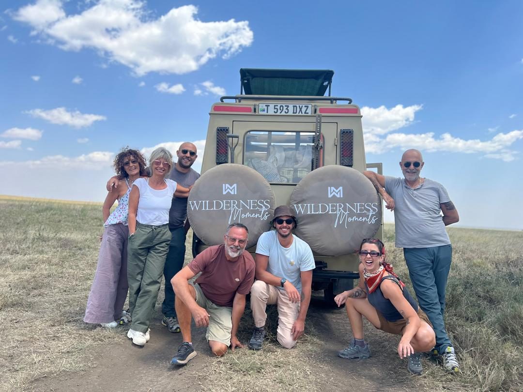 Guests with a Wilderness Moments Tours safari vehicle