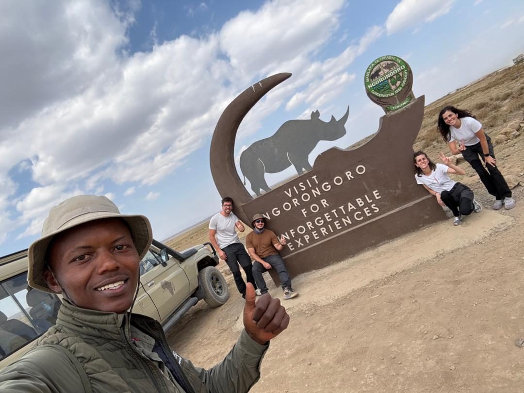 Wilderness Moments guide and guests at the Ngorongoro Conservation Area sign