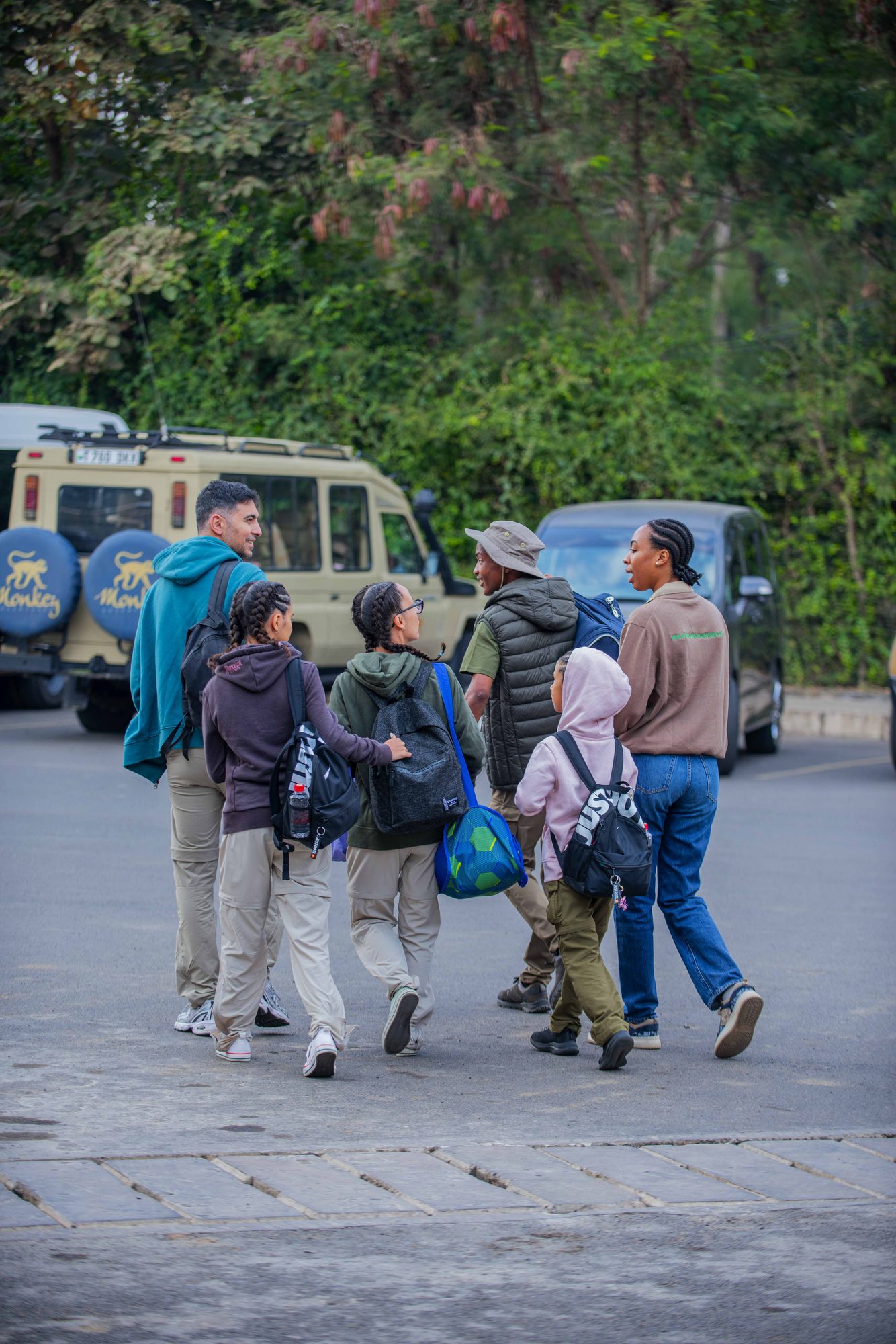 The whole group by our branded safari vehicle