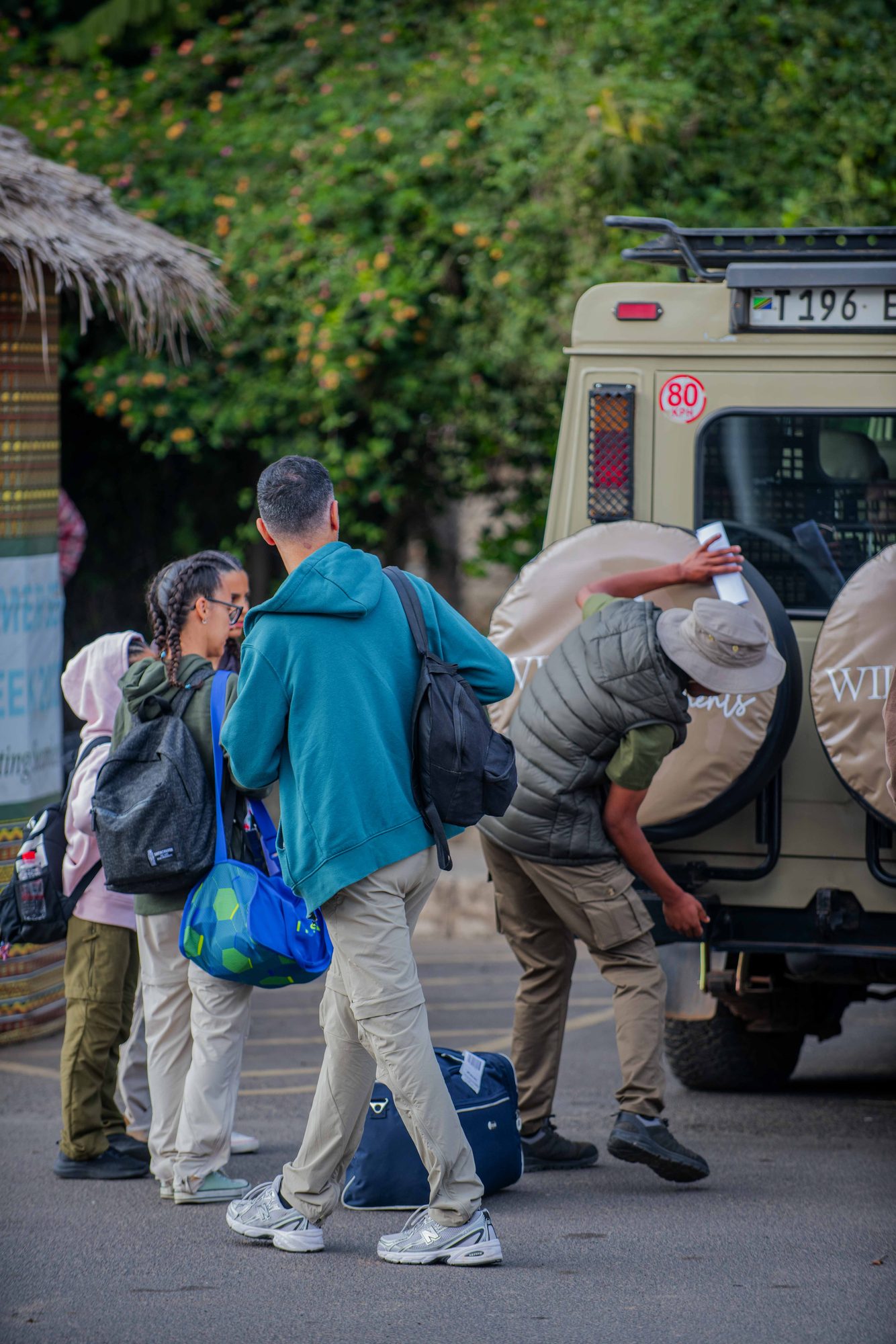 Guests chatting with our guide near the vehicle